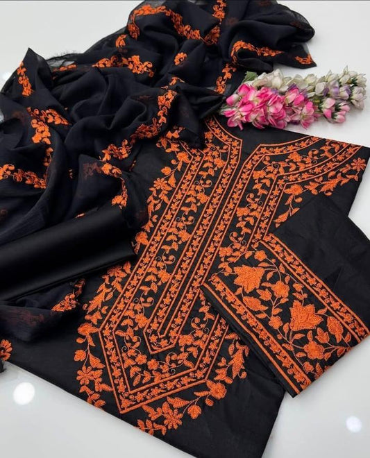 Unstitched 3-piece black lawn cotton suit with heavy orange floral embroidery and matching chiffon dupatta.