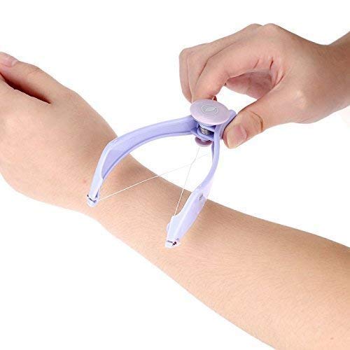 Hand using a small purple device on an arm against a white background