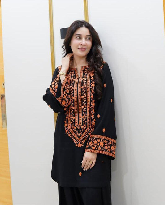 Unstitched 3-piece black lawn cotton suit with heavy orange floral embroidery and matching chiffon dupatta