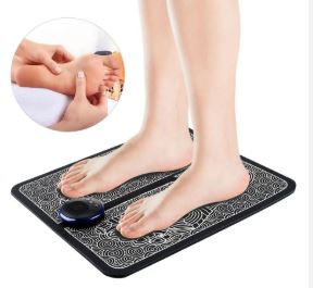 Close-up of a person's bare feet resting on the EMS Foot Massager Pad, using electrical muscle stimulation to boost circulation and relieve pain.