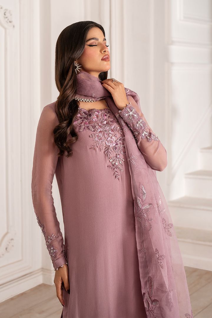 Model wearing a mauve embroidered chiffon unstitched suit with hand-embellished neck.