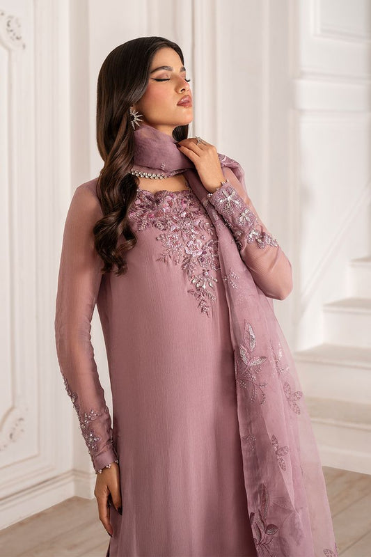 Model wearing a mauve embroidered chiffon unstitched suit with hand-embellished neck.