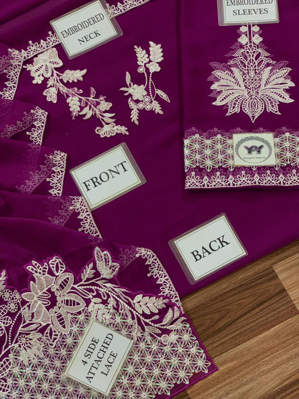 Elegant purple Pakistani unstitched festive wear with heavy white embroidered borders.