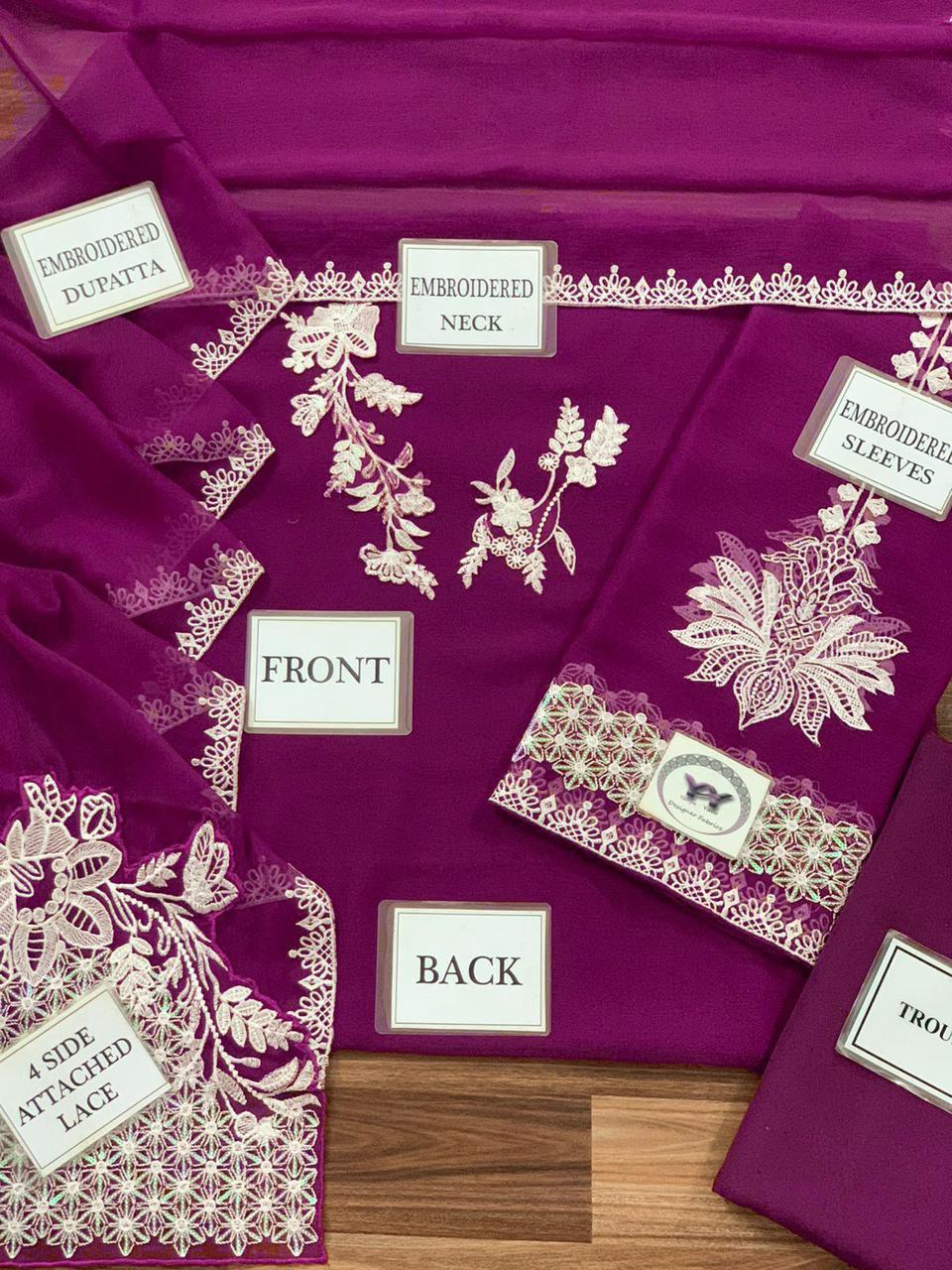 Close-up of white floral embroidery on a royal purple chiffon shirt and dupatta.