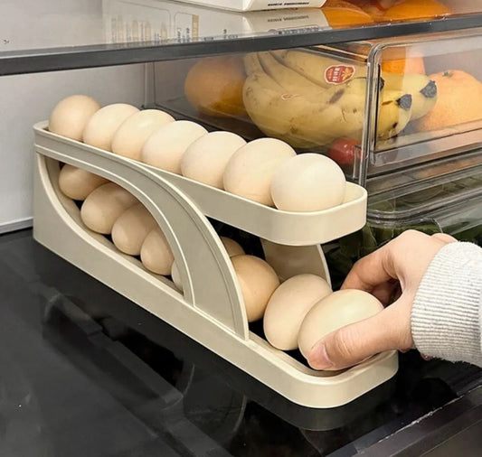Automatic rolling egg dispenser for refrigerator organization.