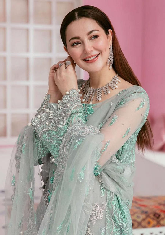 Hania Aamir in a luxury grey and mint green embroidered organza Pakistani suit.