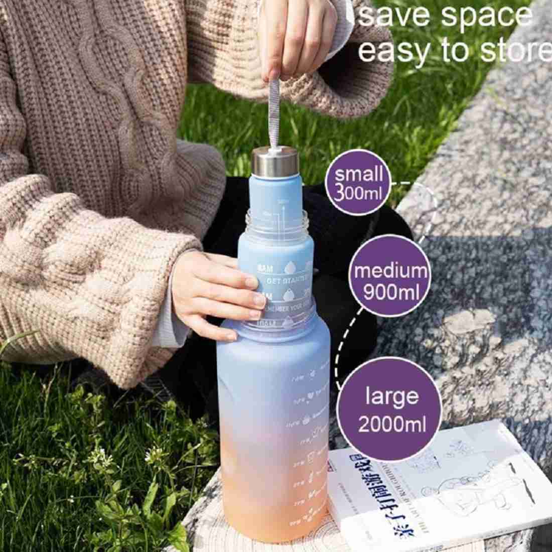 Collection of 2L motivational gradient water bottles in various colors with time markers.