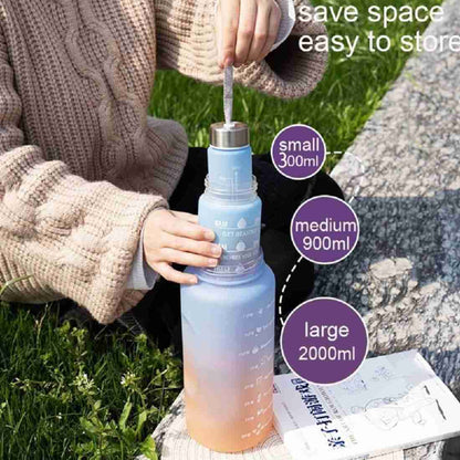 Collection of 2L motivational gradient water bottles in various colors with time markers.